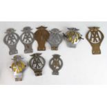 A collection of vintage sundry chromed metal and brass principally AA badges, to include