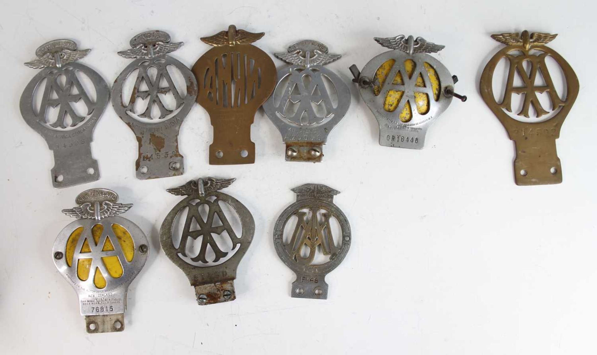 A collection of vintage sundry chromed metal and brass principally AA badges, to include