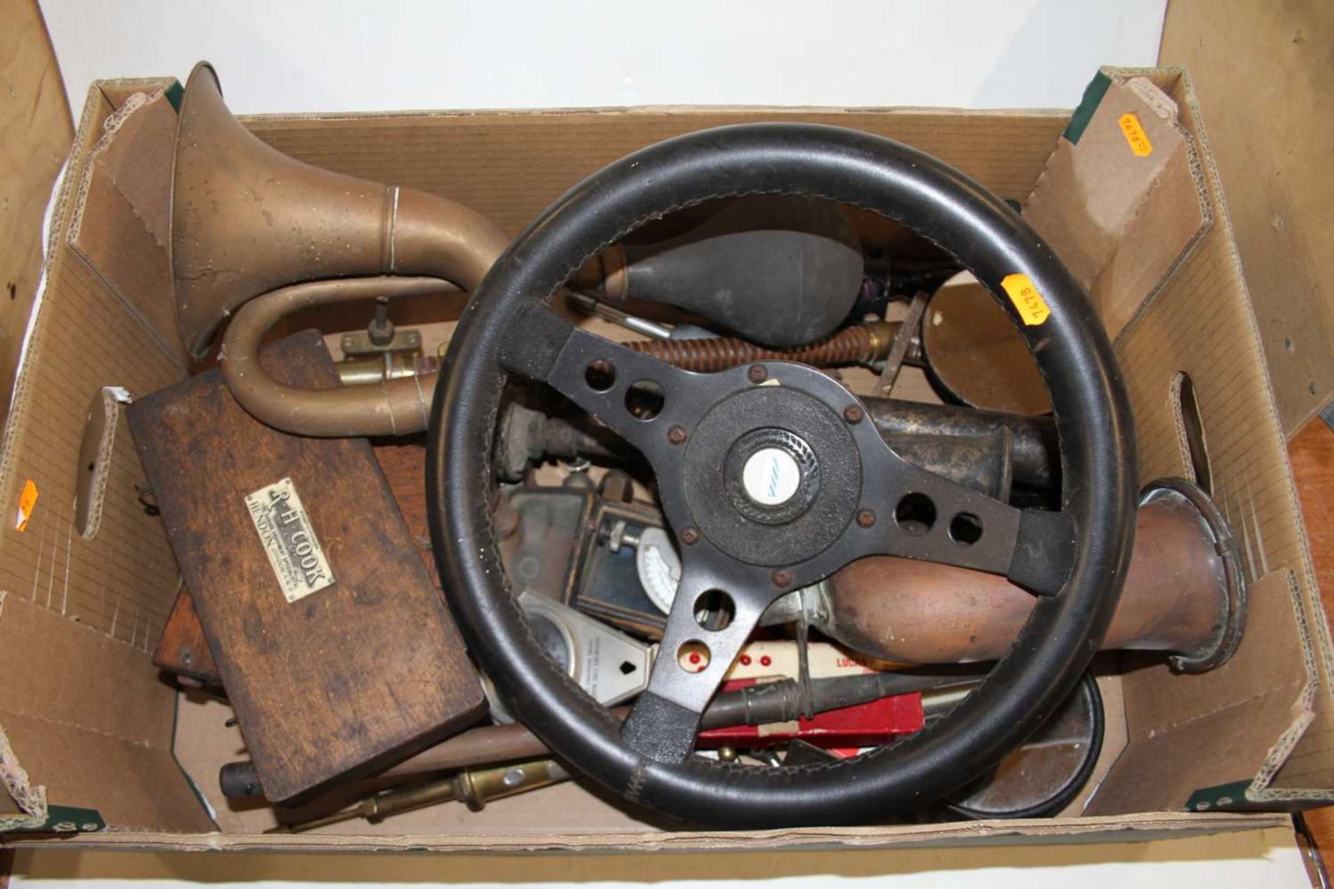 Vintage car parts, to include brass horn, sundry instruments, Austin Rover steering wheel etc