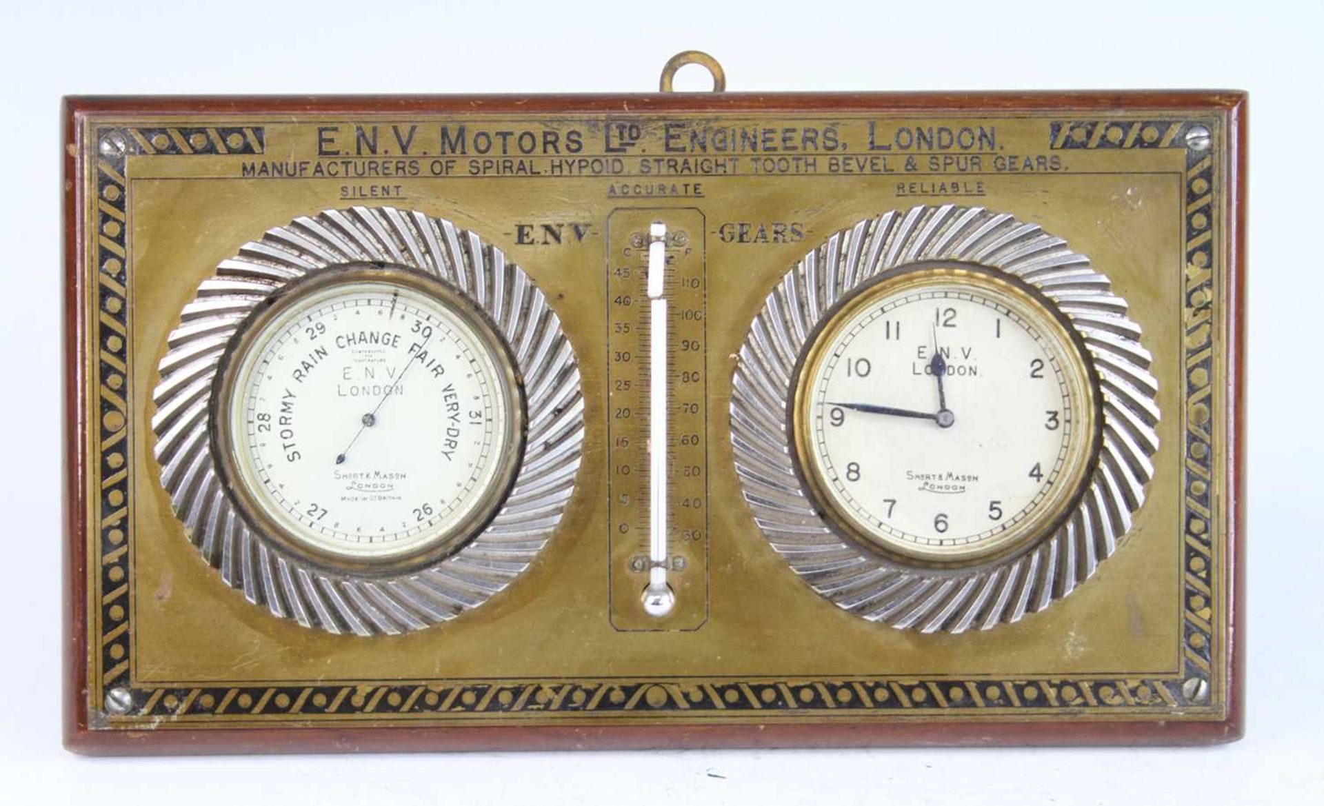 A car twin-dial clock barometer by E.N.V. Motors Ltd Engineers London, with mounted mercury scale (