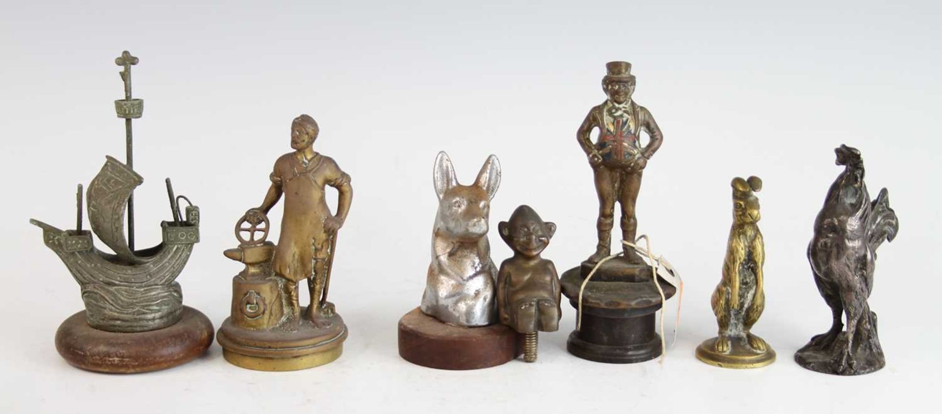 A collection of seven various vintage cast brass and chromed metal car mascots, to include a