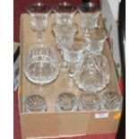 A box of cut glass drinking glasses, to include Waterford brandy glasses, liqueur glasses, and wines