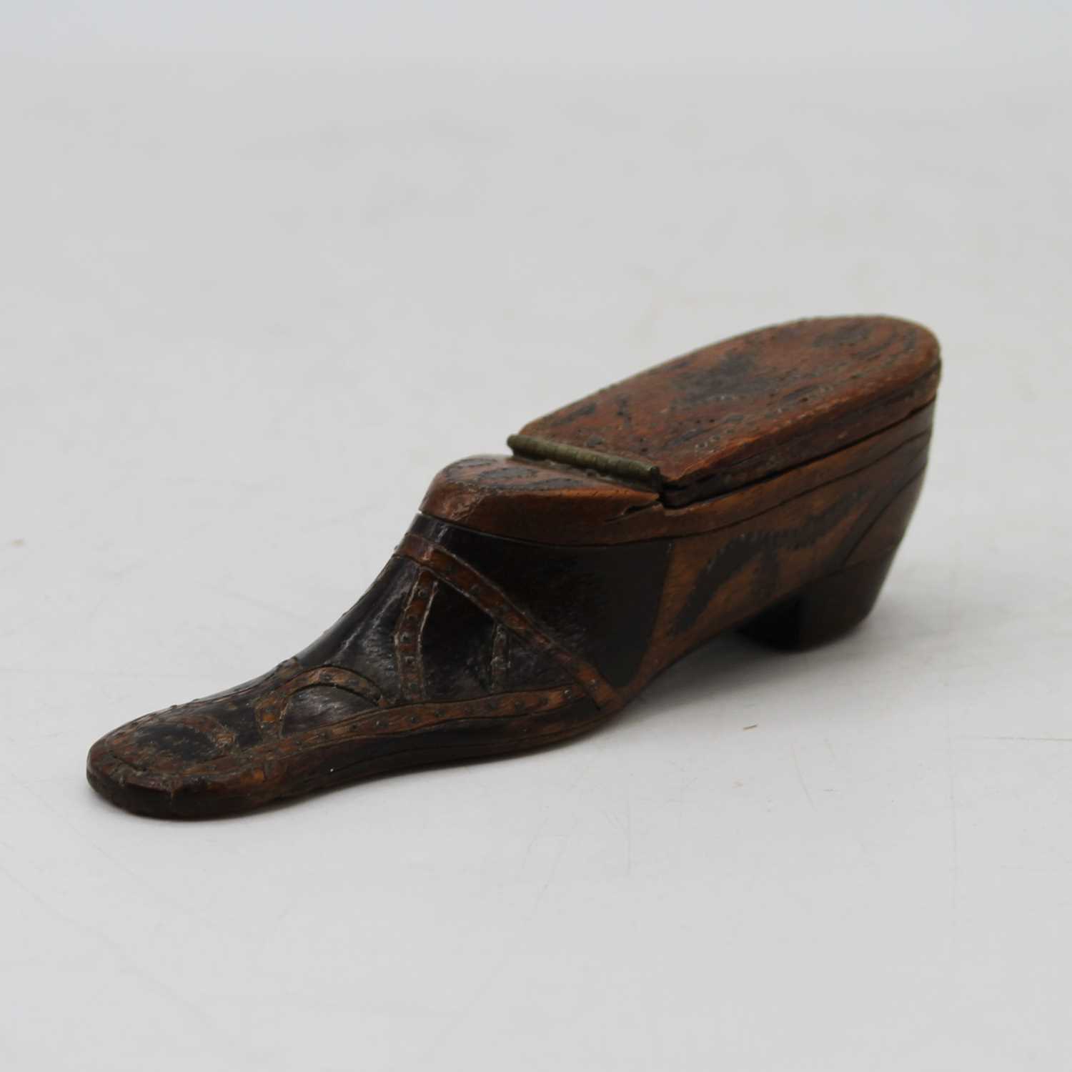 A 19th century carved walnut piquet work snuff box in the form of a shoe, length 12cm