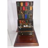 A David Bull Wisbech miniature model of a bureau bookcase, housed within a display case, and dated