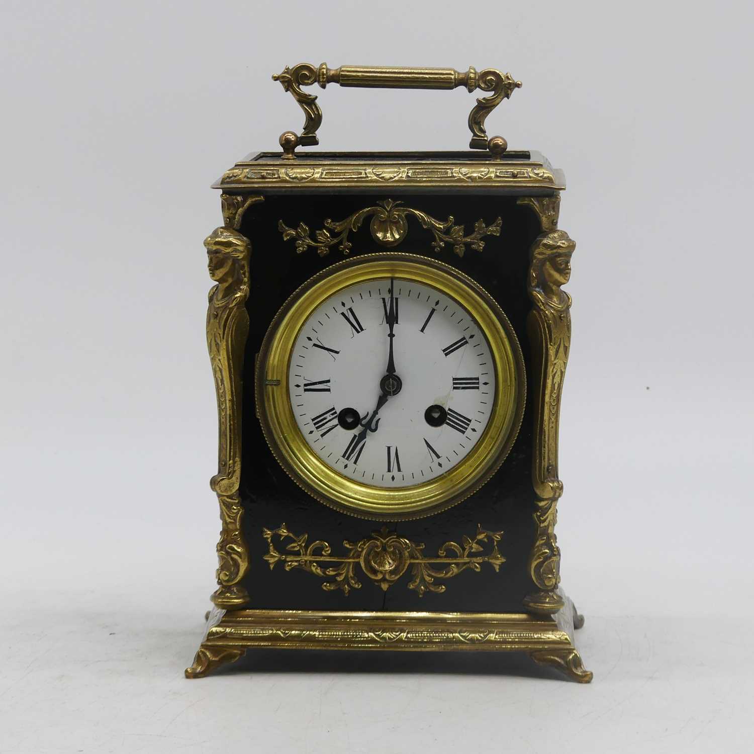 A 19th century French mantel clock, the enamel dial showing Roman numerals, the 8-day movement
