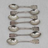 A matched set of seven Elizabeth II silver teaspoons, each having a shield shaped finial, each