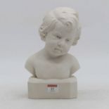A head & shoulders bust of a young boy, height 25cm