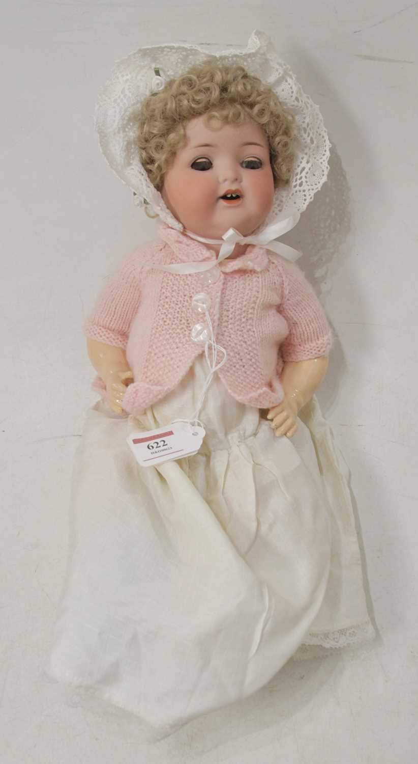 An early 20th century Armand Marseilles bisque head doll, having painted brows and blue rolling