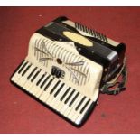 A vintage Sonia pearloid cased piano accordion