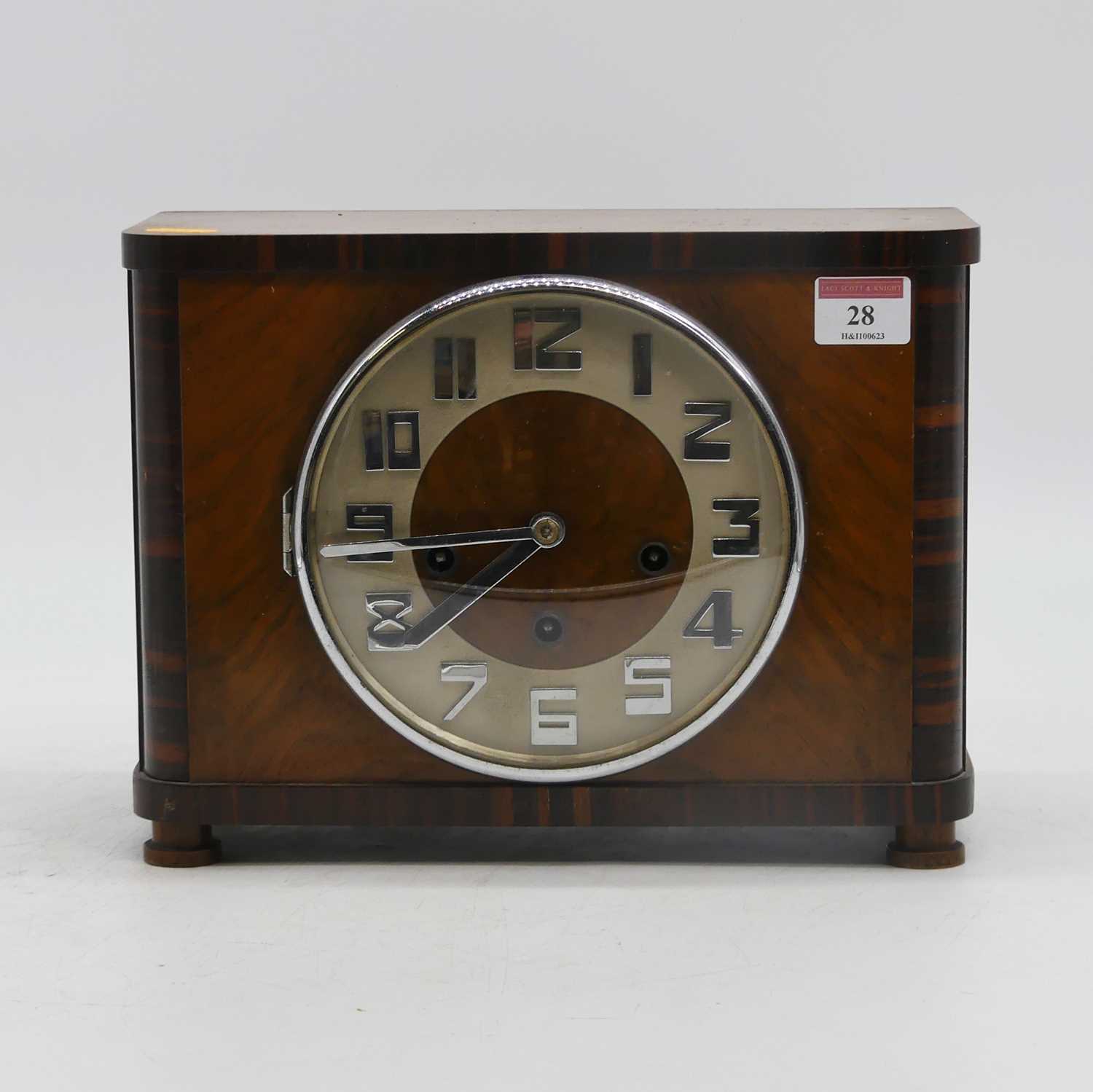 An Art Deco walnut cased 8-day mantel clock, striking on chimes, height 21cm