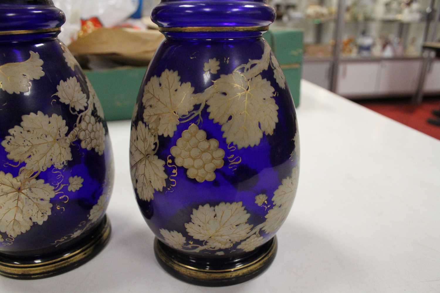A pair of 19th century Bohemian style blue overlaid glass decanters, each decorated with trailing - Image 6 of 8