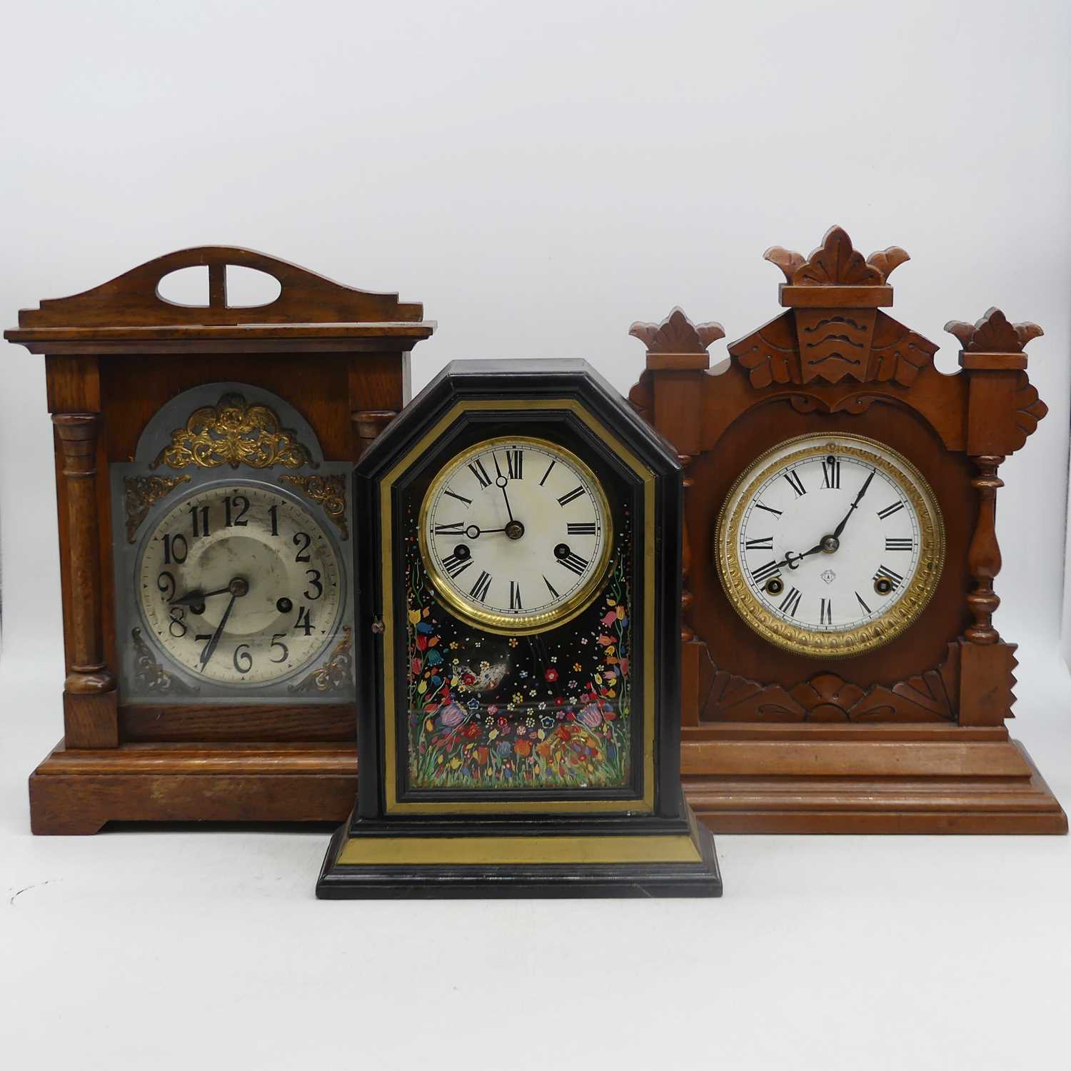 An early 20th century 8-day mantel clock, the enamel dial showing Roman numerals, height 38cm,