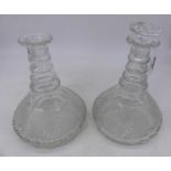 A pair of Regency cut glass decanters, each with bands of diamond-cut decoration, h.22cm; together