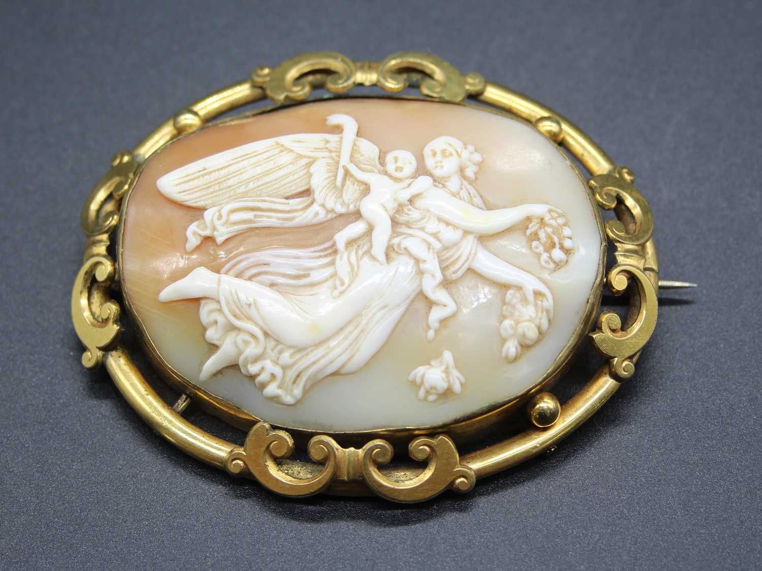 A circa 1900 continental carved shell cameo brooch, in pierced pinchbeck mount, 7 x 5.7cm