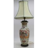 A Chinese porcelain table lamp, enamel decorated with figures, height 70cm including fittings