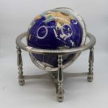 A polished hardstone terrestrial globe on stand, height 44cm