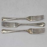 A matched set of three silver table forks in the Old English pattern, London, various dates and