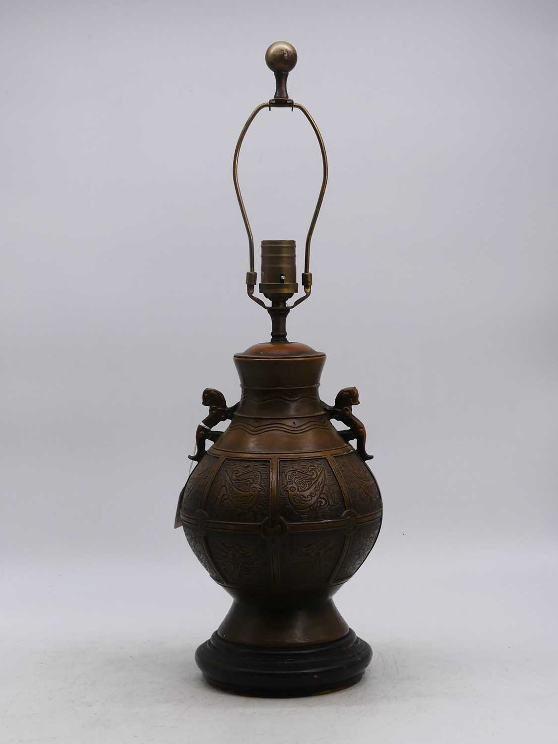 A Chinese style metal table lamp, in the archaic style, height including fittings 62cm