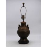 A Chinese style metal table lamp, in the archaic style, height including fittings 62cm