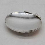 A Danish silver plated dish of plain oval form with a stylised leaf handle, marked to the