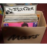 A box of vintage vinyl 12" records and 7" singles, to include Fleetwood Mac Rumours and Stevie