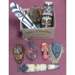 A collection of various African wooden masks