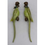 A pair of porcelain wall sconces, each in the form of a parrot, having gilt metal mounts, height