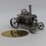 A scratchbuilt metal model of a steam engine, height 20cm together with a brass plaque inscribed "