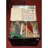 An antique fire proof document box, containing various stamp albums and contents