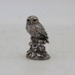 An Elizabeth II filled silver model of an owl on a naturalistic base, Birmingham 1993, 7cm high