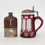 A ruby overlaid glass and pewter mounted tankard having a hinged lid with thumbpiece, height 19cm,