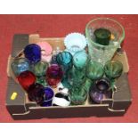 A collection of coloured glassware to include a Dartington crystal vase