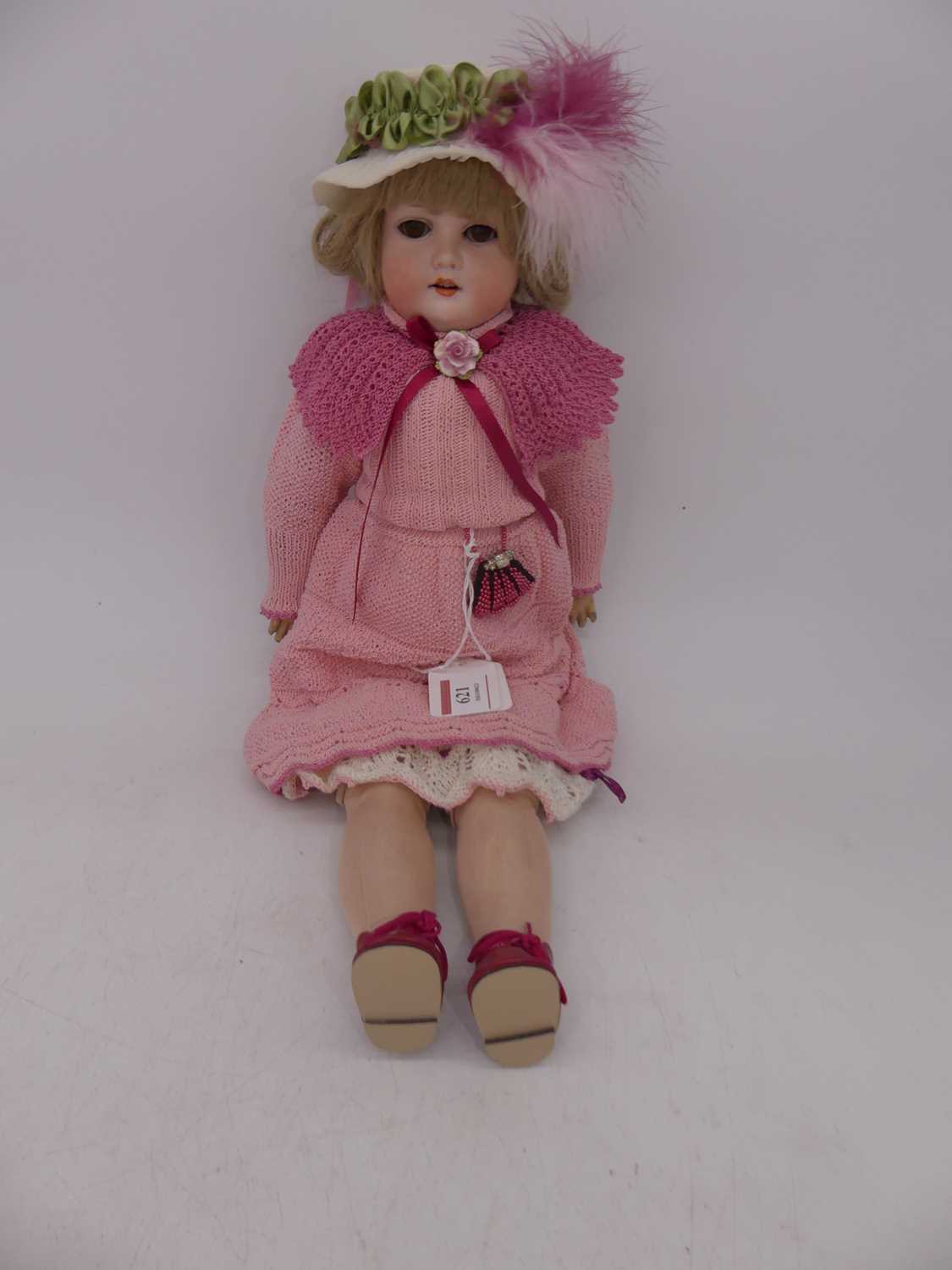 An early 20th century Armand Marseilles bisque head doll, having rolling brown eyes, open mouth with