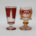 A 19th century Bohemian ruby and amber overlaid glass goblet, height 14cm, together with another