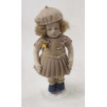A 20th century felt covered doll in the form of a girl, with curly hair, beret, brown crochet