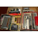 Four trays of 00 gauge related items of rolling stock and lineside accessories to include Triang