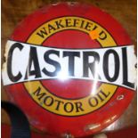 A convex enamel advertising sign for Wakefield Castrol motor oil, dia. 29cm