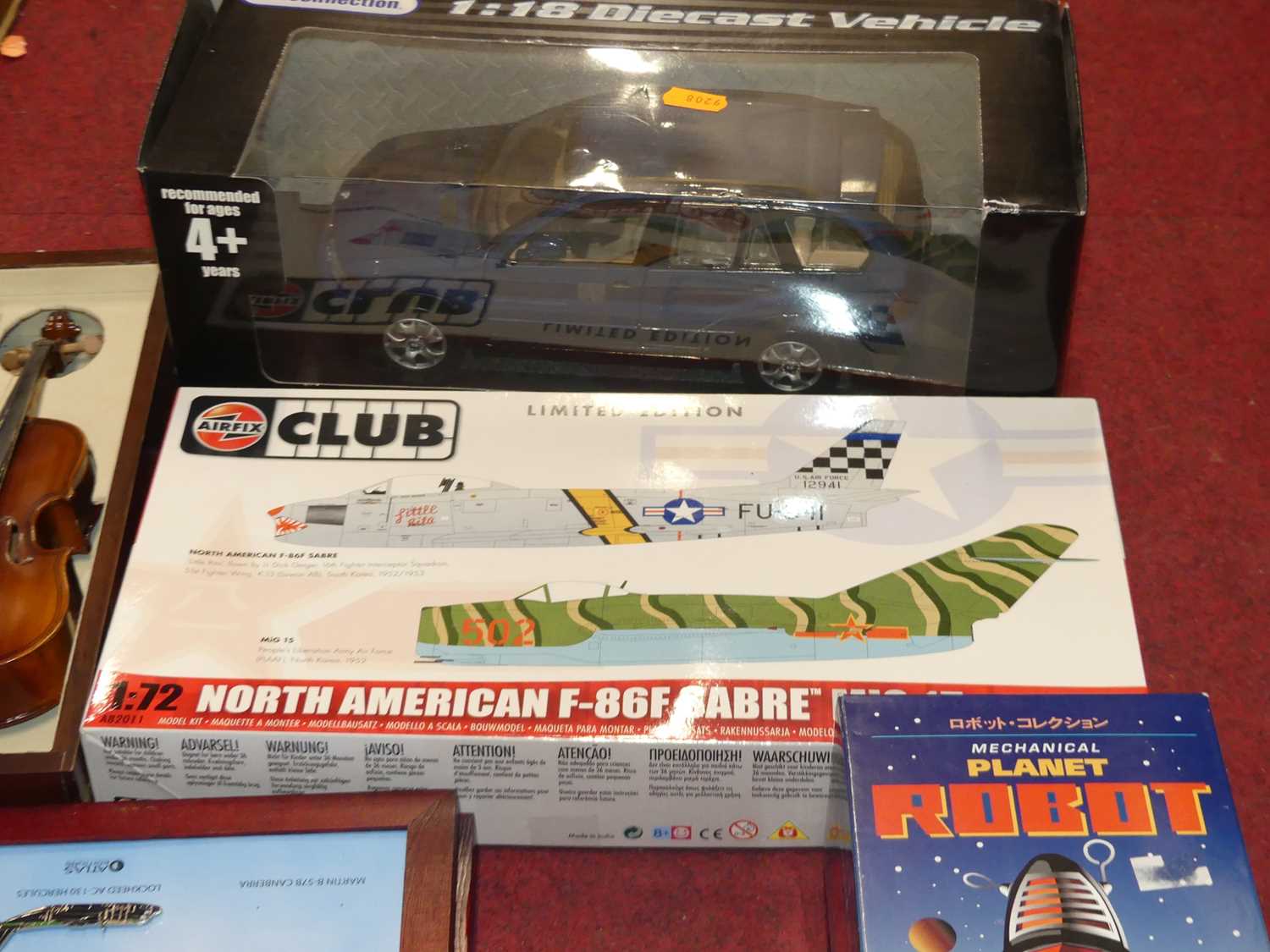 A mixed lot containing a 1/18 scale diecast model of a BMW 4x4, an Airfix Club North American - Image 2 of 3