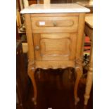 An early 20th century French light oak and white variegated marble top single door pot cupboard,