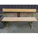 A green painted cast iron ended and pine three seater waiting room bench, length 150cm