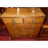 An early 19th century provincial oak chest of two short over three long graduated drawers, width