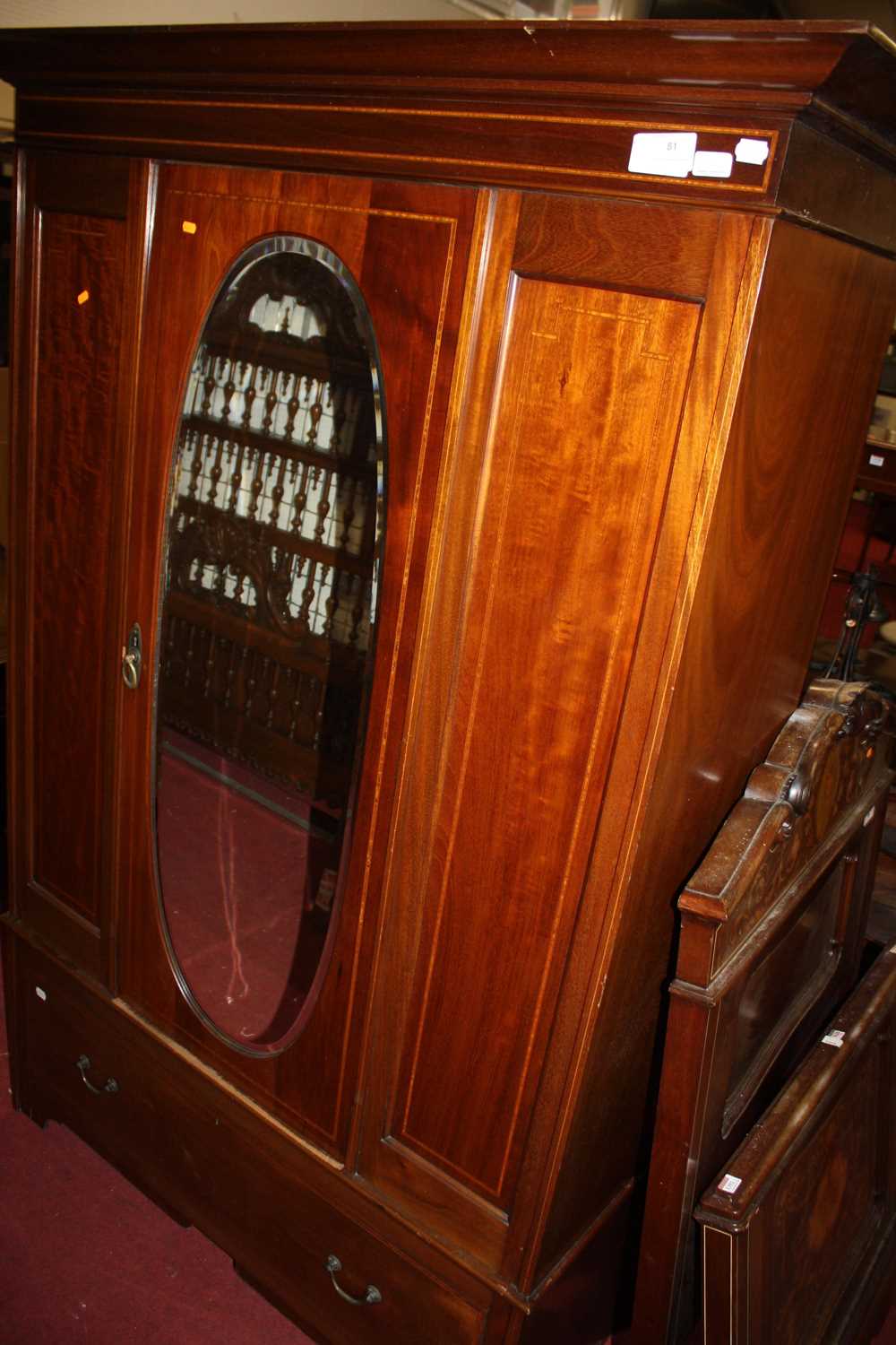 An Edwardian mahogany and satinwood inlaid two piece bedroom suite comprising single mirror door