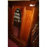 An Edwardian mahogany and satinwood inlaid two piece bedroom suite comprising single mirror door