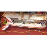 A collection of large scale balsa wood radio controlled model aircraft, some examples require