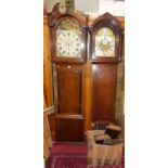 An early 19th century oak long case clock, having a painted arch dial signed A Wightman Moffat, twin