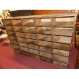 A pine bank of pigeon holes comprising 35 compartments, width 190cmHeight 123cm. Depth 34cm. Width