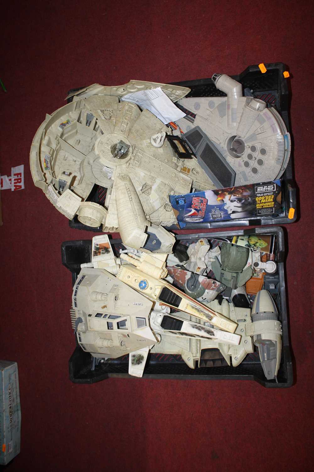 Two trays containing a quantity of mixed vintage Star Wars action figures and vehicles to include