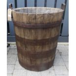 A coopered oak twin handled large cylindrical log bucket, height 66cm, dia. 54cm