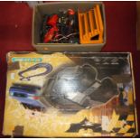 A Scalextric Batman Begins slot racing gift set together with a quantity of associated accessories