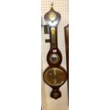 A Regency rosewood four dial wheel barometer (damage to glass to upper dial)